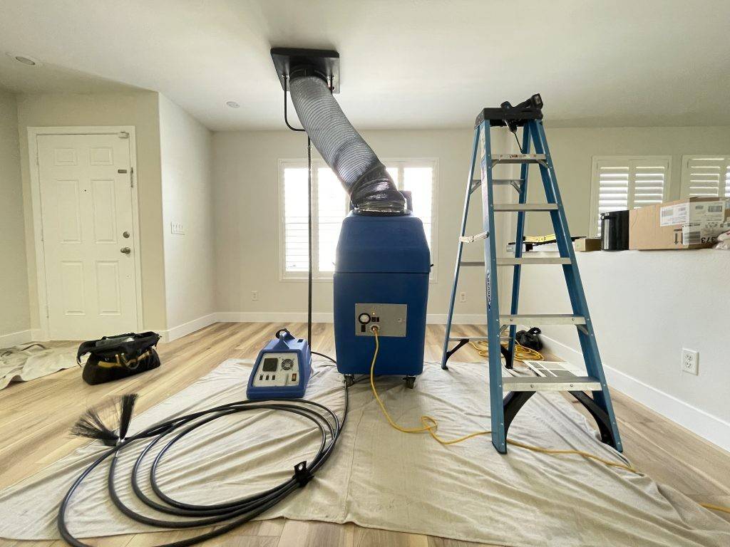 Technicians with vacuum system